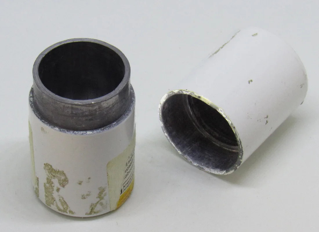 A lidded lead container illustrating shielded material containment